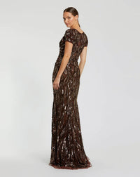 Model wearing Mac Duggal 5243 evening gown with deep V-neckline, cap sleeves, and hand-beaded sequin teardrop pattern.