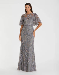 Model wearing the Mac Duggal 68918 gown with a high round neckline, flutter sleeves, allover sequin and beaded detailing, and a trumpet silhouette.