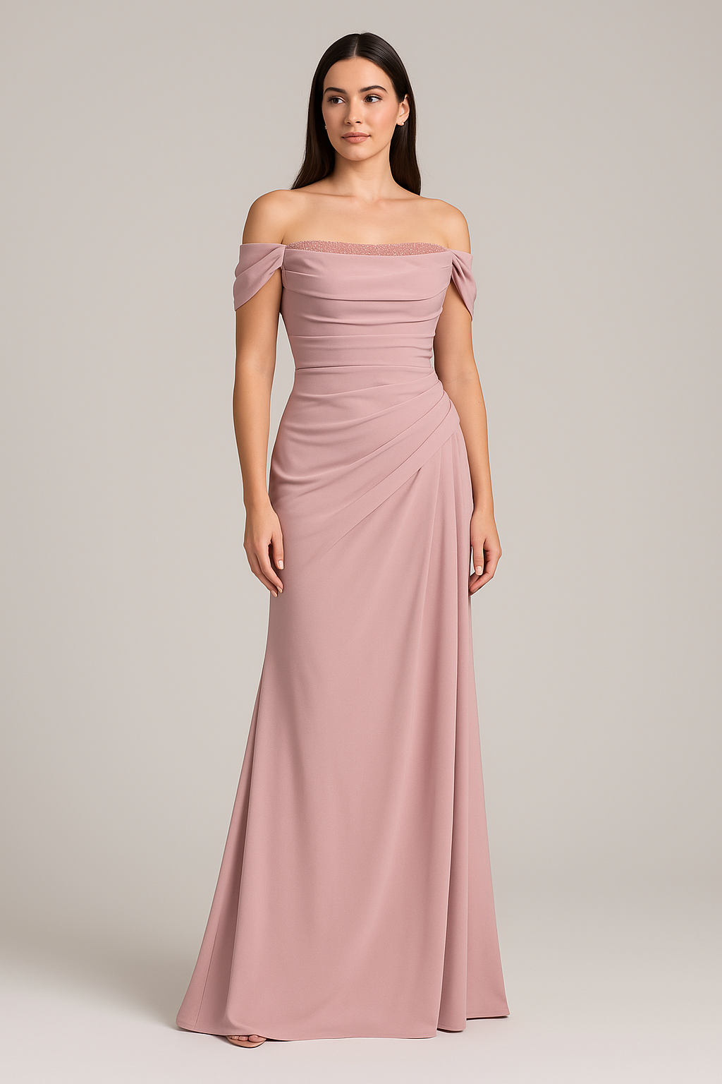 Model wearing Madeline’s Catherine off-shoulder beaded gown with ruched bodice and floor-length skirt.  The model is wearing the color Pink.  Front view.