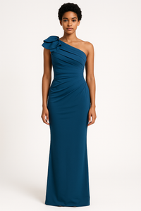 Model wearing the Madeline’s Chloe one-shoulder floor-length gown with ruched detailing and a statement ruffle shoulder.