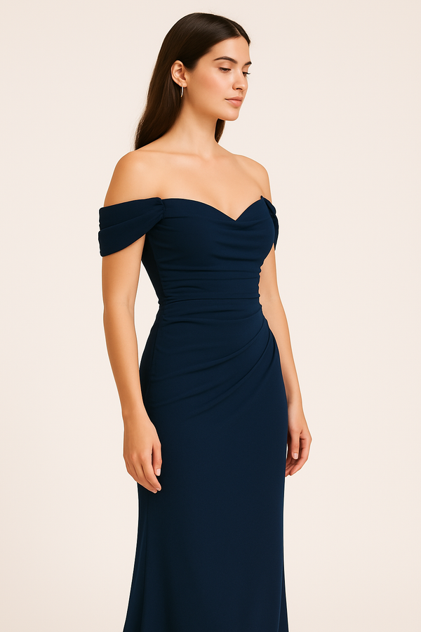 Model wearing the Madeline's Kai off-shoulder navy color gown with ruched bodice and fitted floor-length skirt.