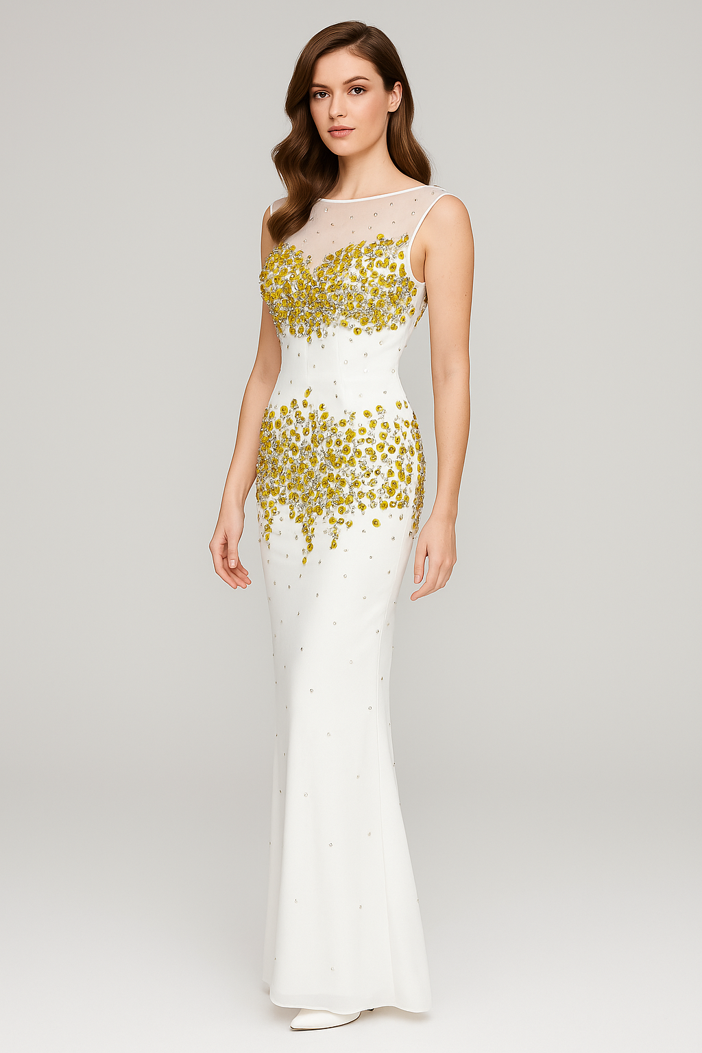 White evening gown with gold embellishments on a gray background
