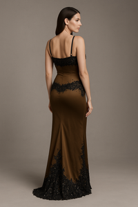 Model wearing Mandalay U01952DEBL embellished fit and flare gown with slim straps, detailed bodice, and floor-length hemline.