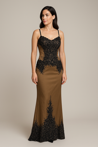 Model wearing Mandalay U01952DEBL embellished fit and flare gown with slim straps, detailed bodice, and floor-length hemline.