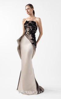 Model wearing the MNM Couture G2045 strapless sculpted evening gown featuring intricate bodice detailing and an asymmetrical floor-length silhouette.