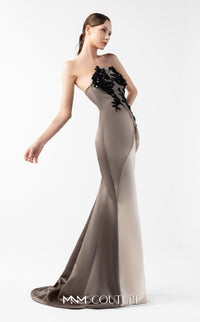 Model wearing the MNM Couture G2045 strapless sculpted evening gown featuring intricate bodice detailing and an asymmetrical floor-length silhouette.