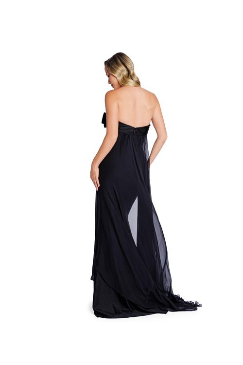 Model wearing Nicole Bakti 7388 gown featuring a strapless bow bodice and chiffon overlay