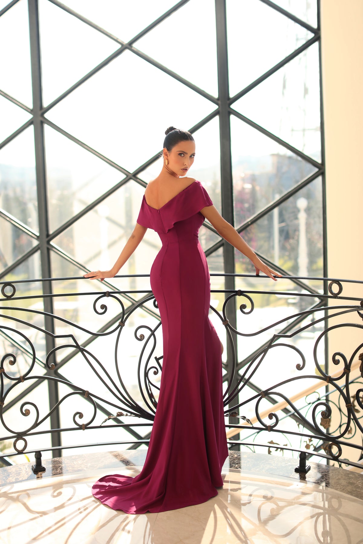 Nicoletta off-the-shoulder dress style NC1040 - Ruched bodice, sweetheart neckline, thigh-high slit, and side ruffle. Perfect for formal evening events and special occasions.