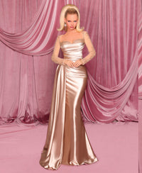 Model wearing Nicoletta NC3078 long sleeve embellished evening gown with sweetheart bodice, draped waist, and fit & flare silhouette.  Model is wearing the color champagne.  Front View.