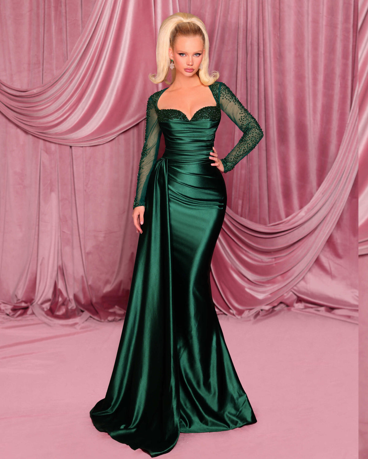 Model wearing Nicoletta NC3078 long sleeve embellished evening gown with sweetheart bodice, draped waist, and fit & flare silhouette.  Model is wearing the color deep emerald.  Front View.