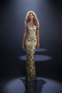 Model wearing Nicoletta NC4014 one-shoulder floral evening gown with fitted silhouette and textured floral detailing.