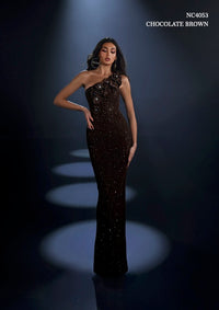 Model wearing Nicoletta NC4053 one-shoulder embellished gown with floral appliqué and fitted silhouette.