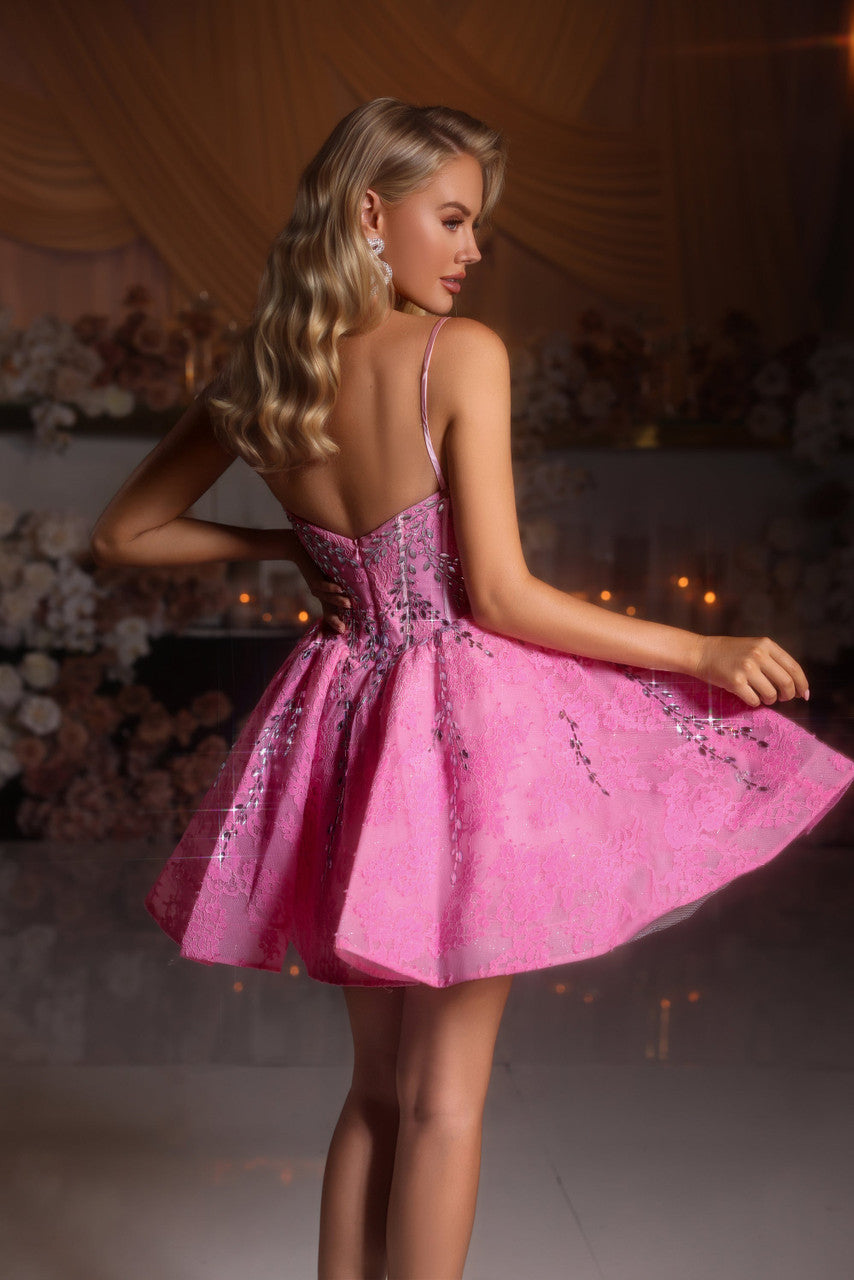 Model wearing Portia & Scarlett PS25784 mini dress with embellished corset and flared skirt.