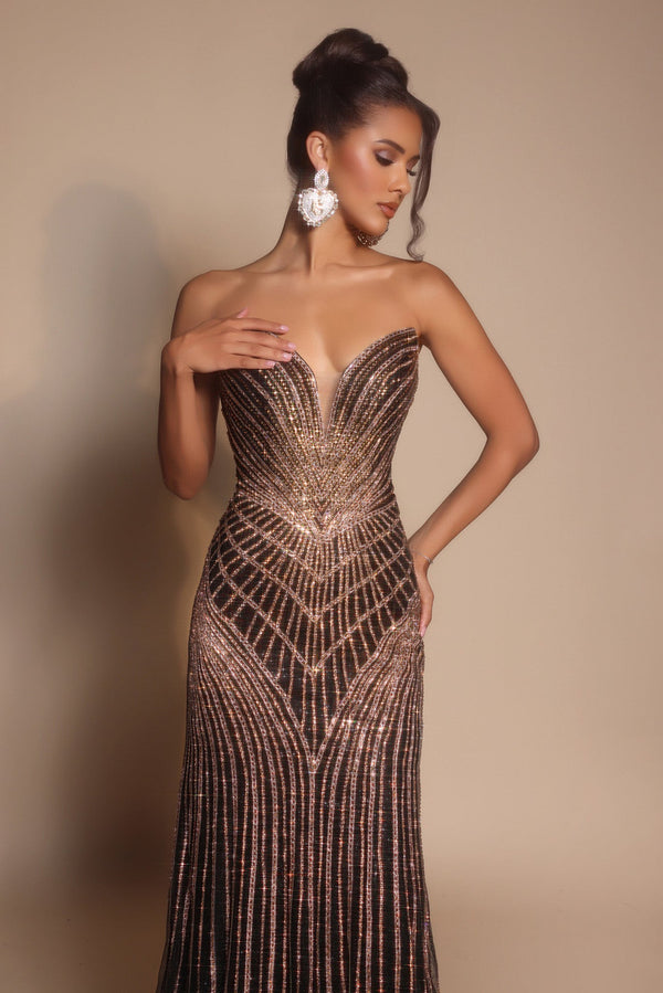Model wearing Portia & Scarlett PS26004 strapless beaded mermaid gown with sweetheart neckline and intricate linear detailing.  Model is wearing the color black.