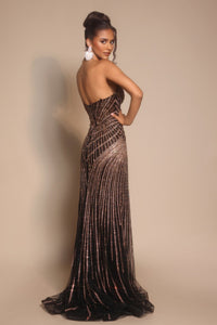 Model wearing Portia & Scarlett PS26004 strapless beaded mermaid gown with sweetheart neckline and intricate linear detailing.  Model is wearing the color black.  Back view.