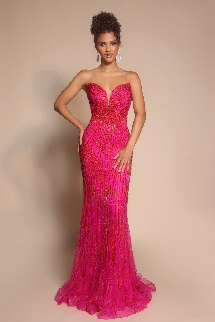 Model wearing Portia & Scarlett PS26004 strapless beaded mermaid gown with sweetheart neckline and intricate linear detailing.  Model is wearing the color fuchsia.