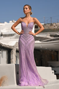 Model wearing Portia & Scarlett PS26004 strapless beaded mermaid gown with sweetheart neckline and intricate linear detailing.  Model is wearing the color lilac.