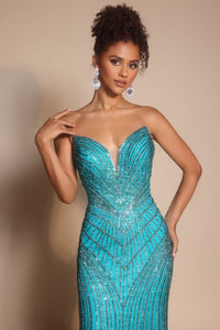 Model wearing Portia & Scarlett PS26004 strapless beaded mermaid gown with sweetheart neckline and intricate linear detailing.  Model is wearing the color peacock.  Close up view,.