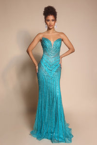 Model wearing Portia & Scarlett PS26004 strapless beaded mermaid gown with sweetheart neckline and intricate linear detailing.  Model is wearing the color peacock.