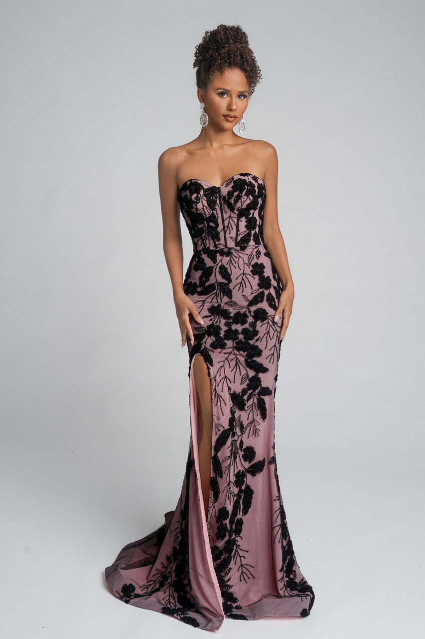 Model wearing Portia & Scarlett PS26074 strapless gown featuring floral appliqué detailing, fitted silhouette, high slit, and floor-length train.