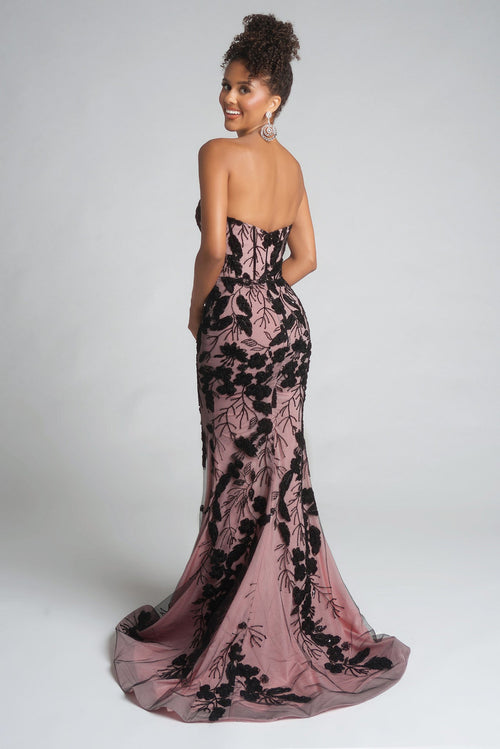 Model wearing Portia & Scarlett PS26074 strapless gown featuring floral appliqué detailing, fitted silhouette, high slit, and floor-length train.