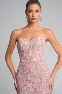 Model wearing Portia & Scarlett PS26074 strapless gown featuring floral appliqué detailing, fitted silhouette, high slit, and floor-length train.