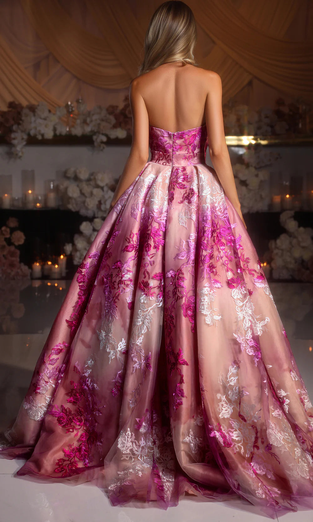 Model wearing Portia & Scarlett PS26075 strapless A-line gown with high slit and floral detailing.