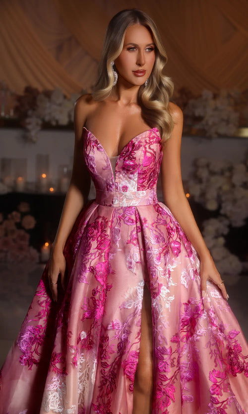 Model wearing Portia & Scarlett PS26075 strapless A-line gown with high slit and floral detailing.
