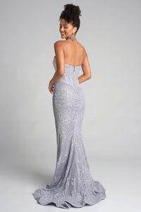Woman wearing a silver strapless gown with a white background