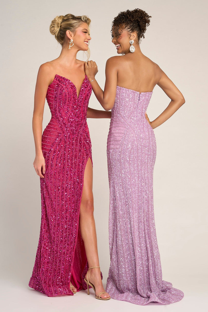 Two women wearing strapless, floor-length dresses in pink and purple.