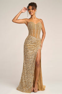 Woman wearing a gold sequin gown with a high slit on a plain background