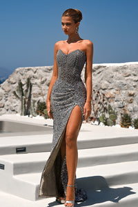 Model wearing Portia & Scarlett PS26432C strapless embellished gown with structured corset bodice and high slit, perfect for formal occasions.