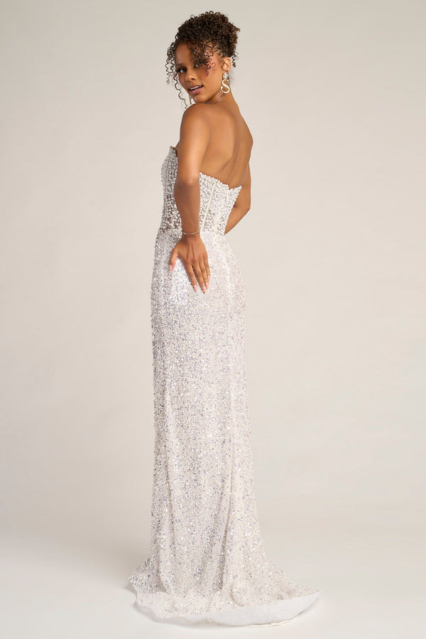 Model wearing Portia & Scarlett PS26432C strapless embellished gown with structured corset bodice and high slit, perfect for formal occasions.