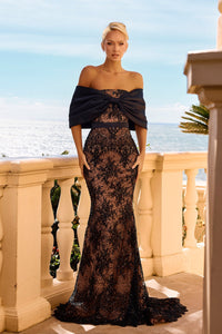 Model wearing Portia & Scarlett PS26912E off-the-shoulder mermaid gown with an embellished lace design, sculpted bodice, and sweeping train.