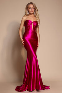 Model wearing the Portia & Scarlett XO080 strapless corset fit-and-flare gown with a structured bodice and floor-length silhouette in the color fuchsia.