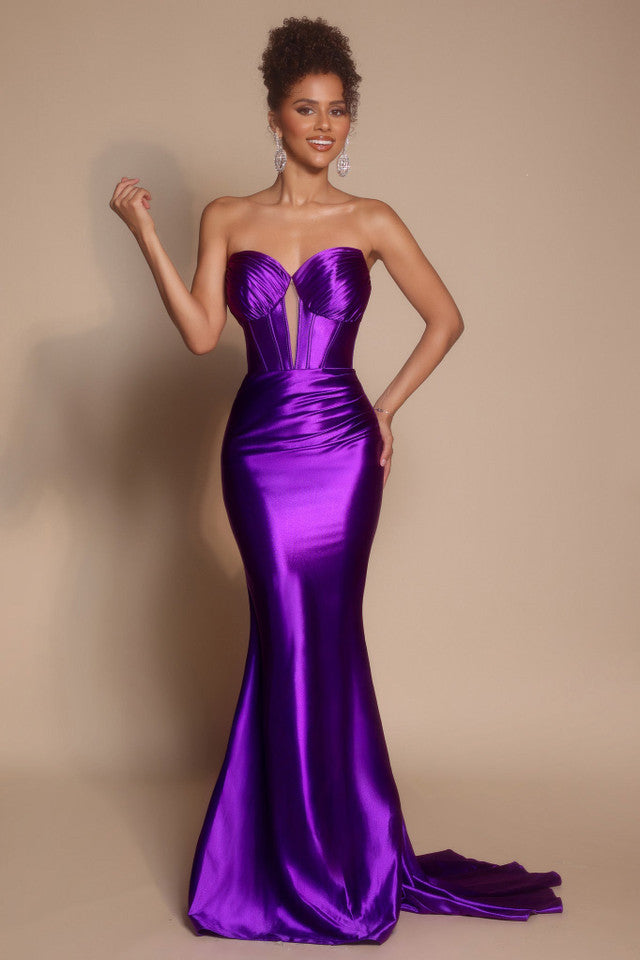 Model wearing the Portia & Scarlett XO080 strapless corset fit-and-flare gown with a structured bodice and floor-length silhouette in the color orchid.
