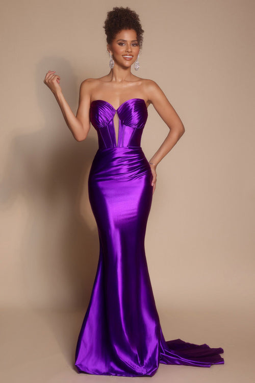 Model wearing the Portia & Scarlett XO080 strapless corset fit-and-flare gown with a structured bodice and floor-length silhouette in the color orchid.