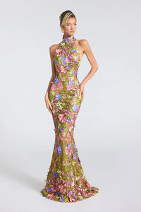 Portia & Scarlett PS27500E high neck floral mermaid gown featuring dimensional floral appliqués, a dramatic open back, and a sweeping train.