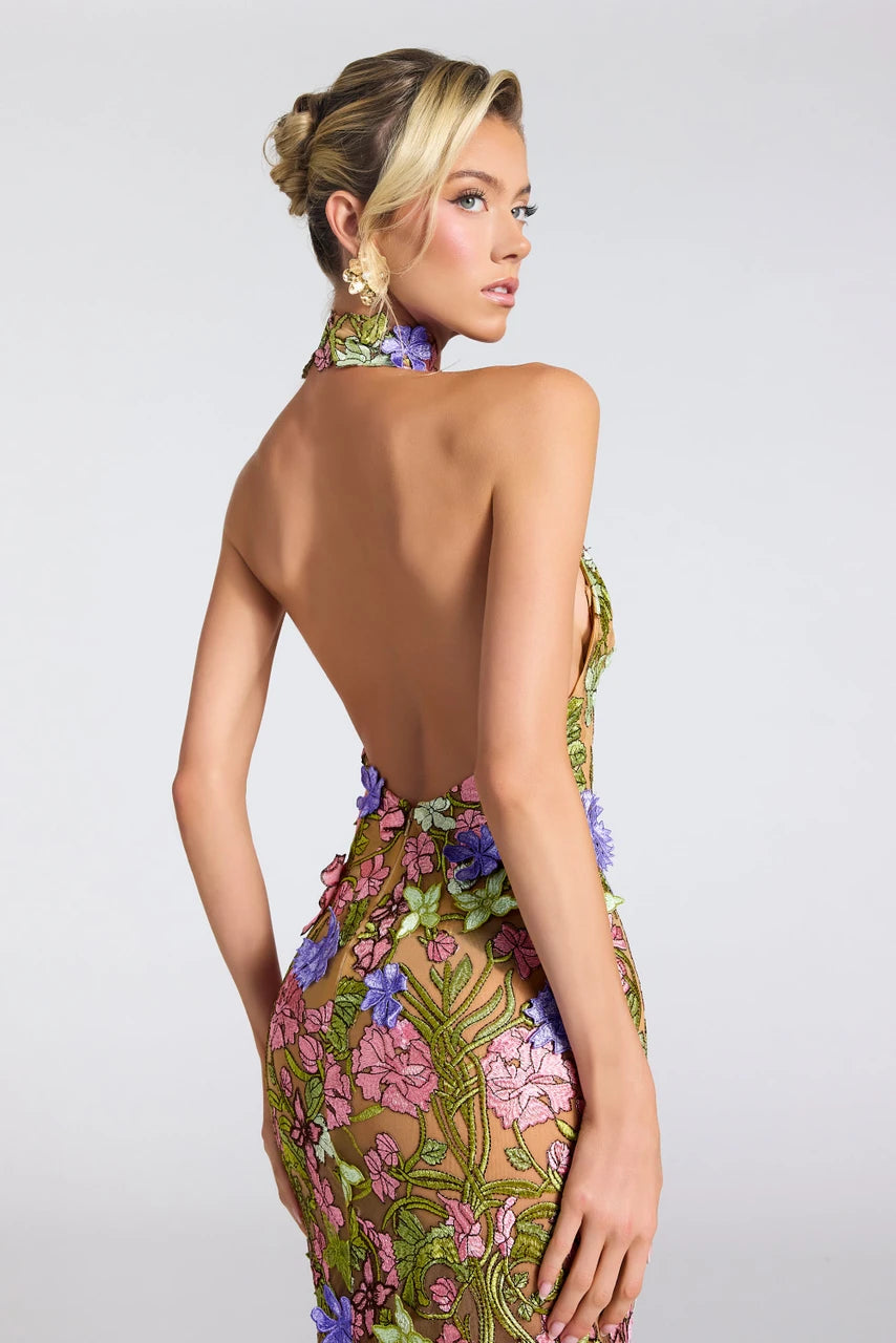 Portia & Scarlett PS27500E high neck floral mermaid gown featuring dimensional floral appliqués, a dramatic open back, and a sweeping train.