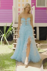 Sherri Hill 56012 Strapless A-line Prom and Quinceañera Gown - An enchanting gown featuring a strapless A-line silhouette, deep V neckline, bow embellishments, and a ruffle skirt with a slit for an elegant and timeless look.  This is a video of the model wearing the dress.