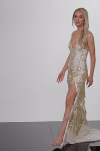 Jovani 38847 Fringe Embellished Formal Evening Gown - A glamorous formal evening gown with a fringe embellished skirt, high slit, and sheer mesh insert on the plunging neck for a dramatic and unforgettable look.  This is a video of the model wearing the dress by Jovani.