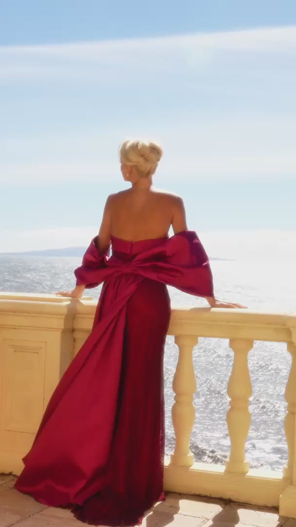 Model wearing Portia & Scarlett PS26904E fitted strapless gown with crystal embellishments, oversized bow detail, and detachable train.  This is a video of the model wearing the dress.