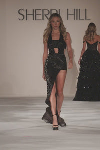 Stunning black fully beaded halter gown by Sherri Hill available at Madeline's in Toronto, Canada and Boca Raton, Florida - perfect for a glamorous evening look. This is a Video of the model walking down the Sherri Hill runway at a fashion Show.