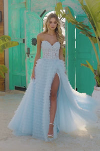 The Sherri Hill Strapless Ballgown with Leaf Lace Corset Bodice, a captivating choice for proms, formal occasions, or a magical quinceañera.  This is a video of the model wearing the dress in light blue.