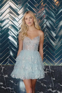 A stunning Sherri Hill 55964 sequin cocktail dress in silver. Perfect for homecoming, bat mitzvahs, and graduation. Available at Madeline's Boutique in Toronto and Boca Raton, Florida.
