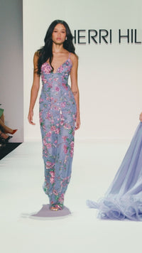 Model wearing Sherri Hill 57670 fitted beaded floral gown with lace-up back and spaghetti straps.  This is a video.