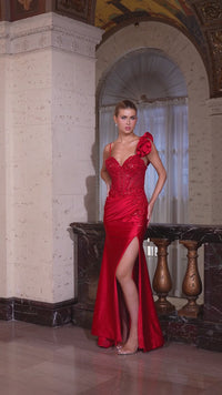 Model wearing Ladivine CM386 gown featuring a sweetheart neckline, 3D floral shoulder detail, beaded sheer bodice, and high slit.