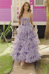 A mesmerizing floral tulle A-line evening gown by Sherri Hill, featuring a keyhole bodice and a ruffle skirt, perfect for elegant occasions.  This is a video of the model wearing the dress.