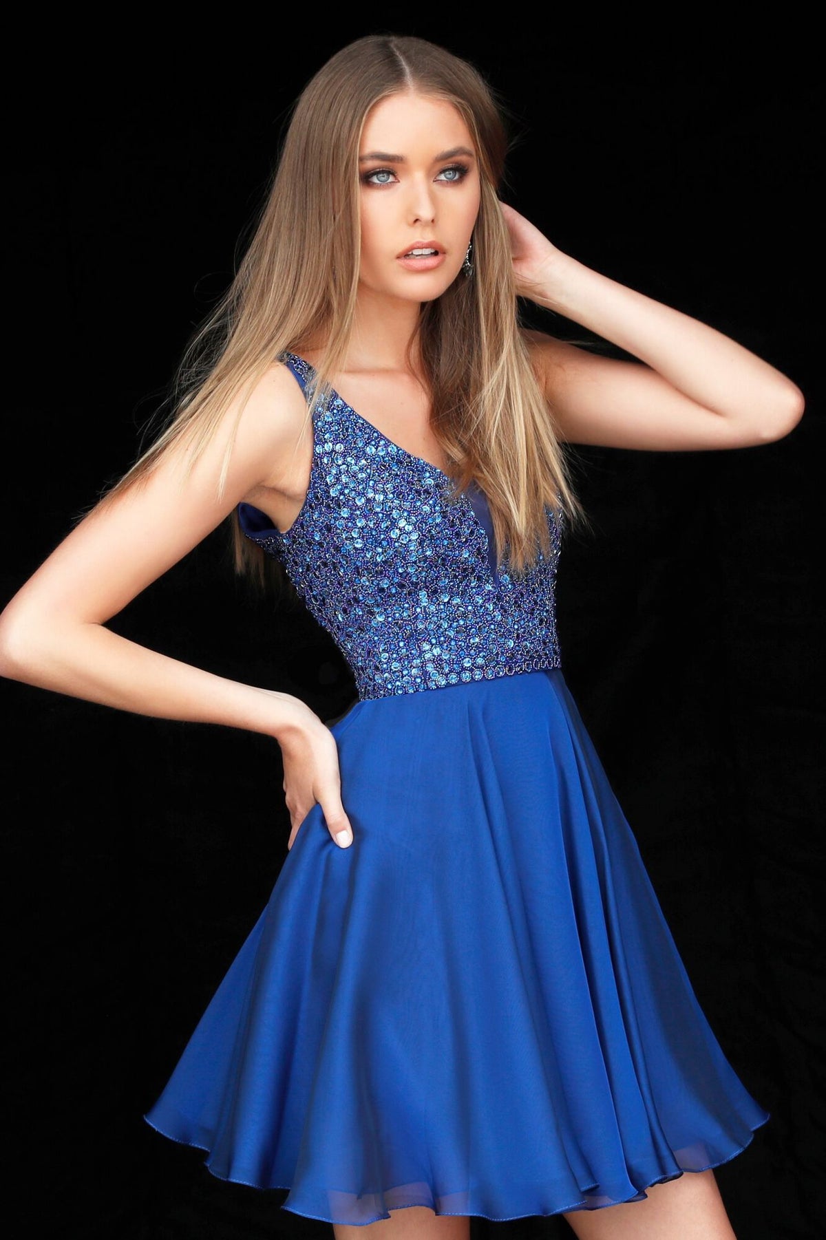 The Sherri Hill Glamorous Beaded V-Neck Cocktail Dress featuring a beaded bodice and a flowing chiffon skirt. Ideal for homecoming and special occasions.