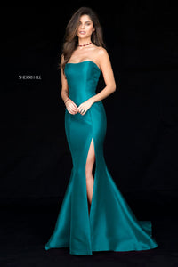Sherri Hill 51671 - An elegant strapless mikado mermaid gown with a high slit, perfect for a sophisticated and timeless look.  The model is wearing the color emerald.